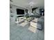 Bright living room features a large sectional sofa, modern decor, and large TV at 12351 Northover Loop, Orlando, FL 32824