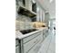 Modern kitchen with stainless steel appliances and grey cabinets at 12351 Northover Loop, Orlando, FL 32824