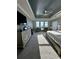 Bright main bedroom with a king-size bed and sitting area at 12351 Northover Loop, Orlando, FL 32824