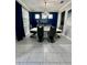 Elegant dining room with a large table, modern chairs, and a stylish chandelier at 12351 Northover Loop, Orlando, FL 32824