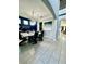 Open concept dining area with contemporary furniture and a large format art piece at 12351 Northover Loop, Orlando, FL 32824