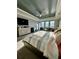 Spacious main bedroom with king-size bed and sitting area at 12351 Northover Loop, Orlando, FL 32824