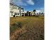 Two-story house with balcony and grassy backyard at 12351 Northover Loop, Orlando, FL 32824