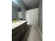 Clean bathroom with updated vanity and tub shower at 12351 Northover Loop, Orlando, FL 32824