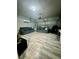 Spacious garage conversion with room for seating and a workspace at 12351 Northover Loop, Orlando, FL 32824