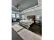 Luxurious main bedroom with king-size bed and large windows at 12351 Northover Loop, Orlando, FL 32824