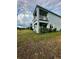 Two-story house with balcony and grassy backyard at 12351 Northover Loop, Orlando, FL 32824