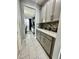 Butlers pantry with grey shaker cabinets, quartz countertops, and tile backsplash at 12351 Northover Loop, Orlando, FL 32824
