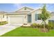 Charming one-story home with teal door at 834 Ballantyne Dr, Lake Wales, FL 33898