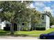 Two-story house with gray siding, black shutters, and a landscaped lawn at 2039 Florida Soapberry Blvd, Orlando, FL 32828