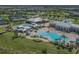 Aerial view of community amenities including pools and tennis courts at 2700 Greenlands St, Saint Cloud, FL 34772