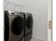 Bright laundry room features Samsung washer and dryer at 840 Crooked Branch Dr, Clermont, FL 34711