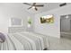 Spacious bedroom with a large TV and a white dresser at 840 Crooked Branch Dr, Clermont, FL 34711
