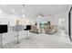 Open living room featuring a kitchen island, seating, and modern tile floors at 840 Crooked Branch Dr, Clermont, FL 34711