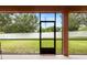 Screened patio overlooking a fenced backyard at 840 Crooked Branch Dr, Clermont, FL 34711