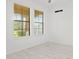 Bright office space with two large windows and white tile floors at 840 Crooked Branch Dr, Clermont, FL 34711