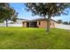 Spacious backyard with grassy lawn and home at 840 Crooked Branch Dr, Clermont, FL 34711