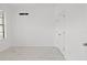 Spacious spare bedroom with large window, white walls, and tile floors at 840 Crooked Branch Dr, Clermont, FL 34711