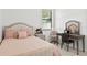 Bedroom with a vanity and a comfortable-looking bed at 840 Crooked Branch Dr, Clermont, FL 34711