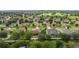 Aerial view of house and surrounding neighborhood at 840 Crooked Branch Dr, Clermont, FL 34711