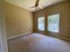 Bright bedroom with carpet and two windows at 3601 Daydream Pl, Saint Cloud, FL 34772