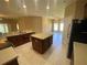 Spacious kitchen with island, stainless steel appliances, and lots of cabinet space at 3601 Daydream Pl, Saint Cloud, FL 34772