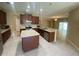 Open concept kitchen with island, stainless steel appliances and view to Gathering room at 3601 Daydream Pl, Saint Cloud, FL 34772