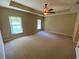 Large bedroom with carpeted floors and ceiling fan at 3601 Daydream Pl, Saint Cloud, FL 34772