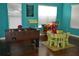 Bright playroom with foosball table, furniture, and toys at 3208 Cupid Pl, Kissimmee, FL 34747