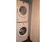Stackable washer and dryer in the laundry closet at 3208 Cupid Pl, Kissimmee, FL 34747