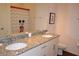 Bathroom with double vanity, granite countertop, and Mickey Mouse theme at 3208 Cupid Pl, Kissimmee, FL 34747