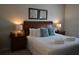 King-size bed, nightstands, and ample natural light at 3208 Cupid Pl, Kissimmee, FL 34747