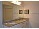 Double vanity bathroom with granite countertop at 3208 Cupid Pl, Kissimmee, FL 34747