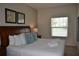 King size bed, dresser and large window in bright bedroom at 3208 Cupid Pl, Kissimmee, FL 34747