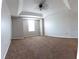 Spacious bedroom with plush carpeting and large window at 2480 Hassonite St, Kissimmee, FL 34744