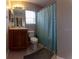 Bathroom with shower/tub combo, tile floor, and vanity at 2480 Hassonite St, Kissimmee, FL 34744