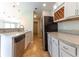 Kitchen with stainless steel appliances and granite countertops at 2480 Hassonite St, Kissimmee, FL 34744