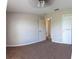 Well-lit bedroom with carpeted floor and ceiling fan at 2480 Hassonite St, Kissimmee, FL 34744