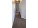 Clean and well-lit hallway with carpeted flooring at 2480 Hassonite St, Kissimmee, FL 34744