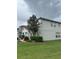 Two-story house with landscaping and a green lawn at 2480 Hassonite St, Kissimmee, FL 34744