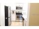 Kitchen with stainless steel appliances and white cabinets at 2480 Hassonite St, Kissimmee, FL 34744