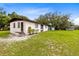 Ranch style home with a large yard and detached workshop at 950 S Narcoossee Rd, St Cloud, FL 34771