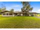 Ranch style home with covered patio and spacious yard at 950 S Narcoossee Rd, St Cloud, FL 34771