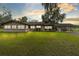Single story home with covered patio and large yard at 950 S Narcoossee Rd, St Cloud, FL 34771