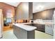 Kitchen with dark wood cabinets and a breakfast bar at 950 S Narcoossee Rd, St Cloud, FL 34771