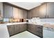 Retro kitchen features dark wood cabinets, and a pass-through to the dining area at 950 S Narcoossee Rd, St Cloud, FL 34771
