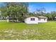 White single story home with covered patio and large backyard at 950 S Narcoossee Rd, St Cloud, FL 34771