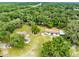 Aerial view showing two houses on a spacious lot surrounded by lush greenery at 950 S Narcoossee Rd, St Cloud, FL 34771