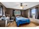 Bedroom with double bed, desk, and ample natural light at 950 S Narcoossee Rd, St Cloud, FL 34771