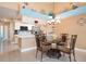 Kitchen with stainless steel appliances, breakfast bar, and adjacent dining area at 5012 Laguna Bay Cir # 74, Kissimmee, FL 34746